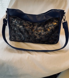 Modified Kiana by Butter Bags.  Blue with dragonfly print. Exterior vinyl with cotton interior